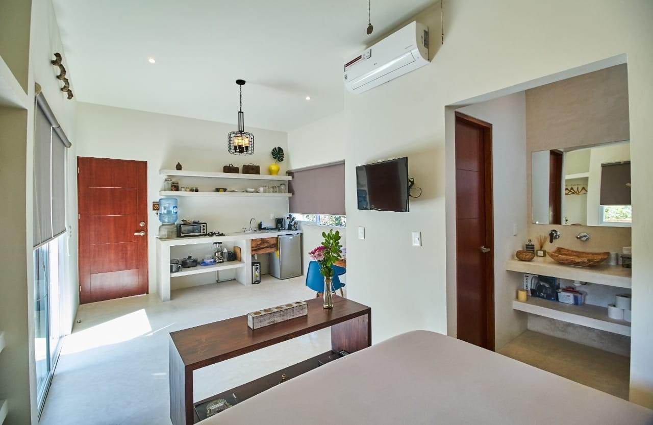 Kitchenette with toaster, stove, and front door